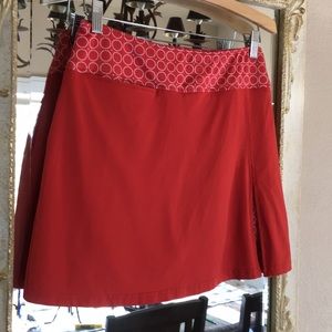 GolfHer skort. Dark orange/white. Size XS
